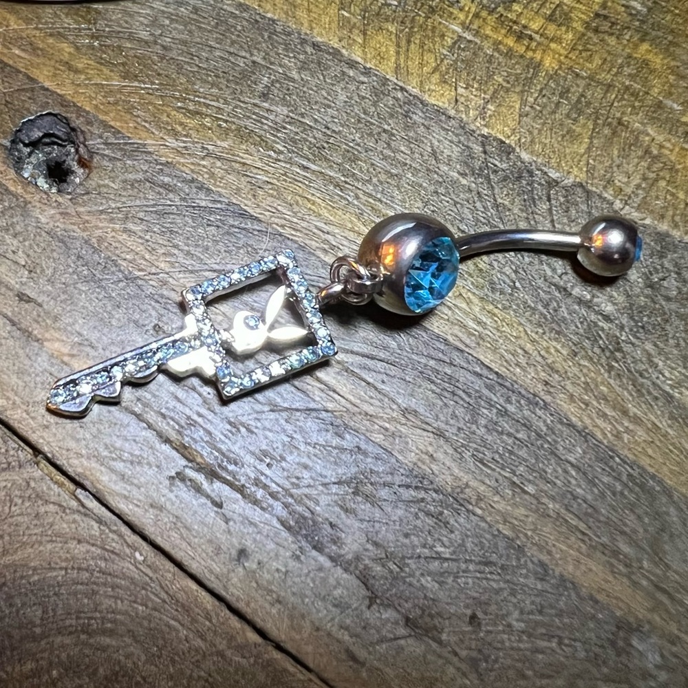 Playboy belly ring